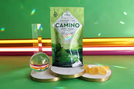 Relax and Unwind with Camino Sleep Gummies Woman taking Camino Sleep Gummy before bedtime routine